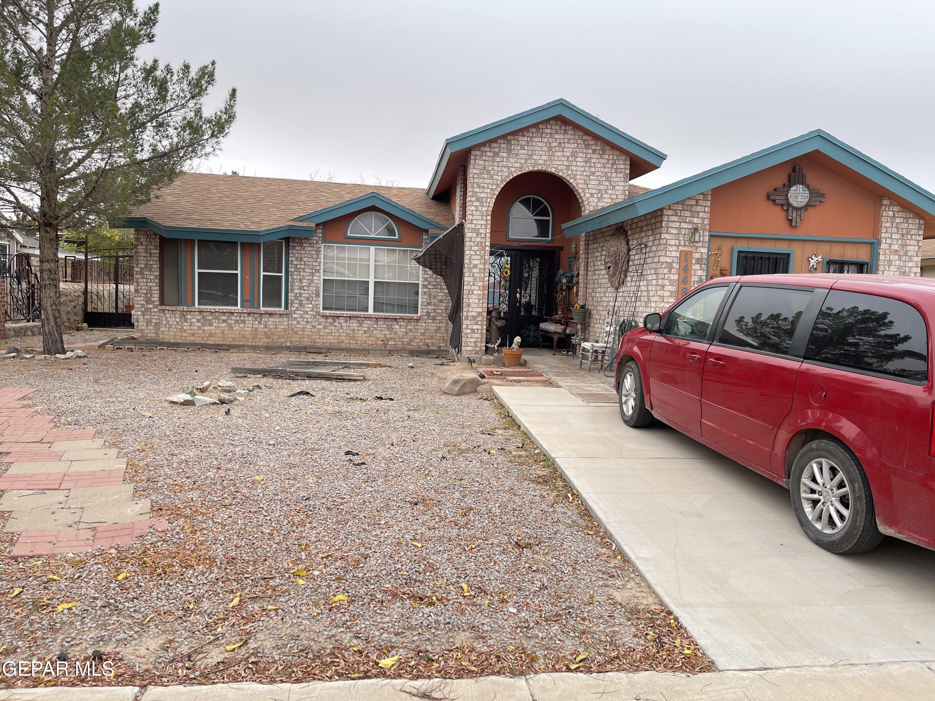 a front view of a house with parking