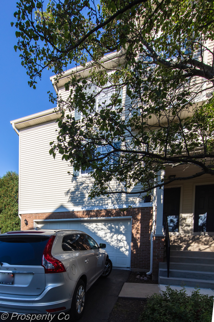 a view of a car in front of a building