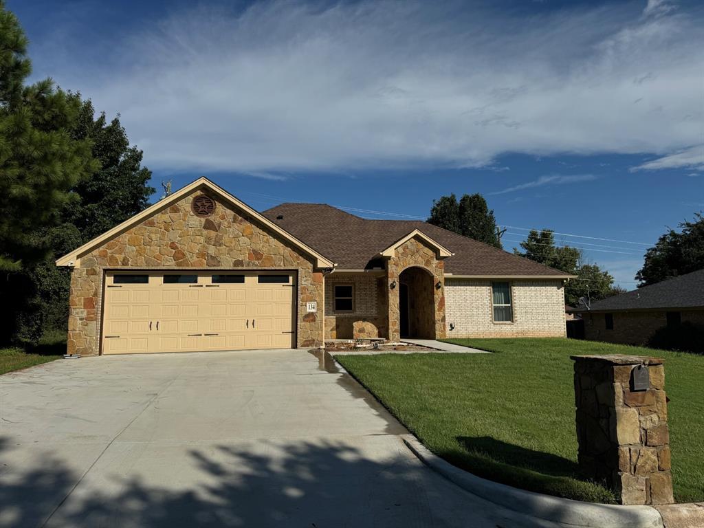 front view of a house with a yard