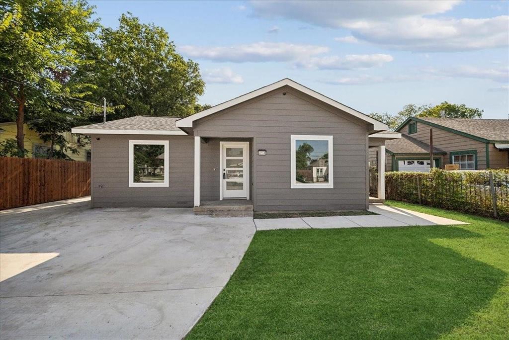 front view of a house with a yard