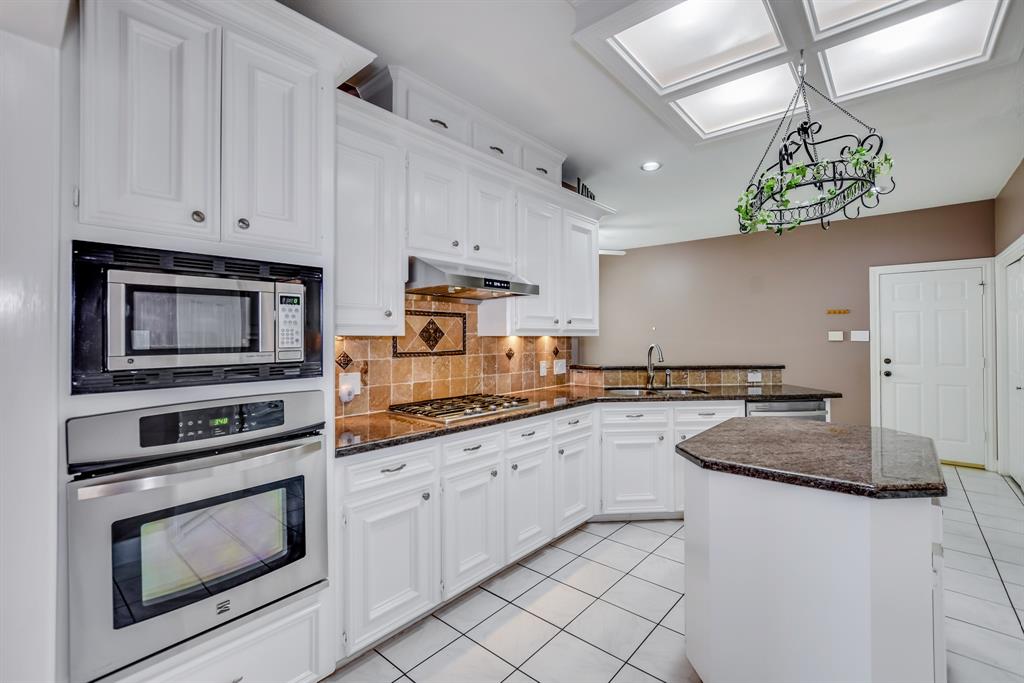 Kitchen- Inlcudes a large island, lots of counter area and stainless steel applicances.