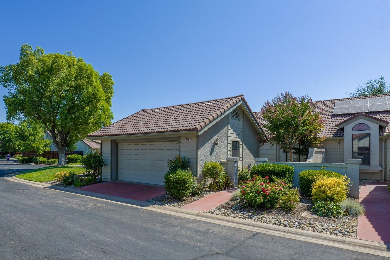 a front view of a house with garden