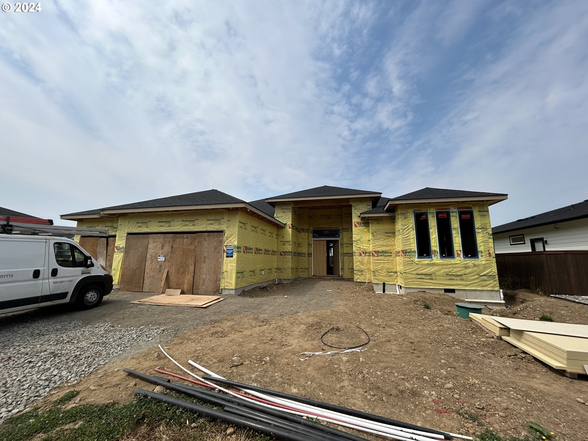 a front view of a house with parking space