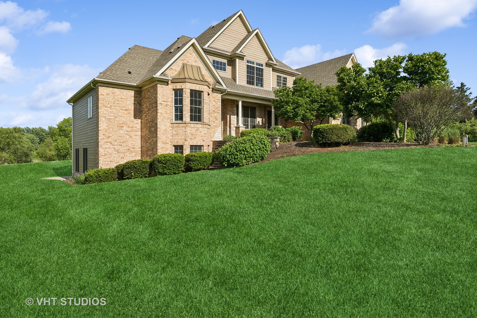 a front view of a house with a yard