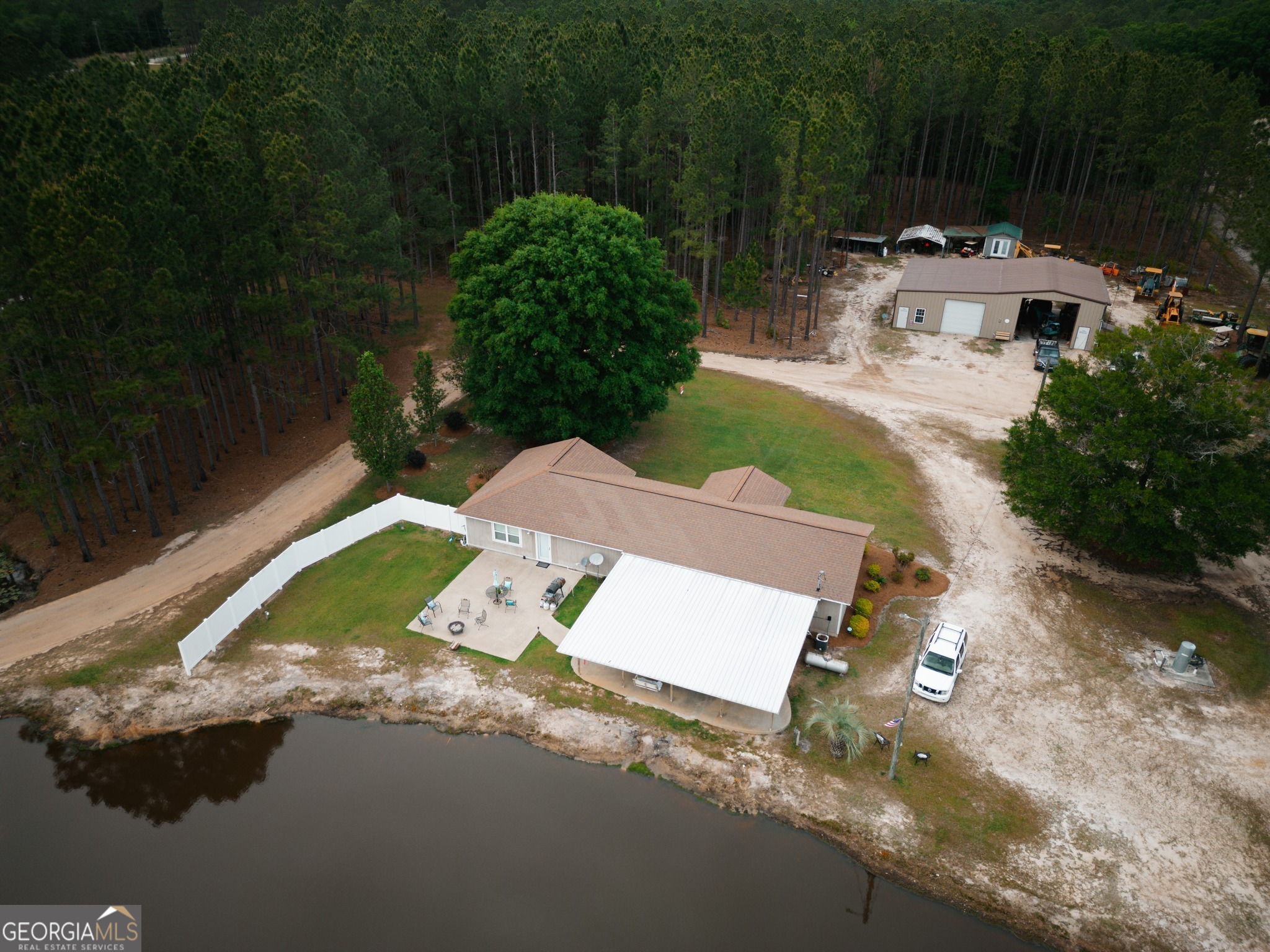 an aerial view of a house with garden space and street view