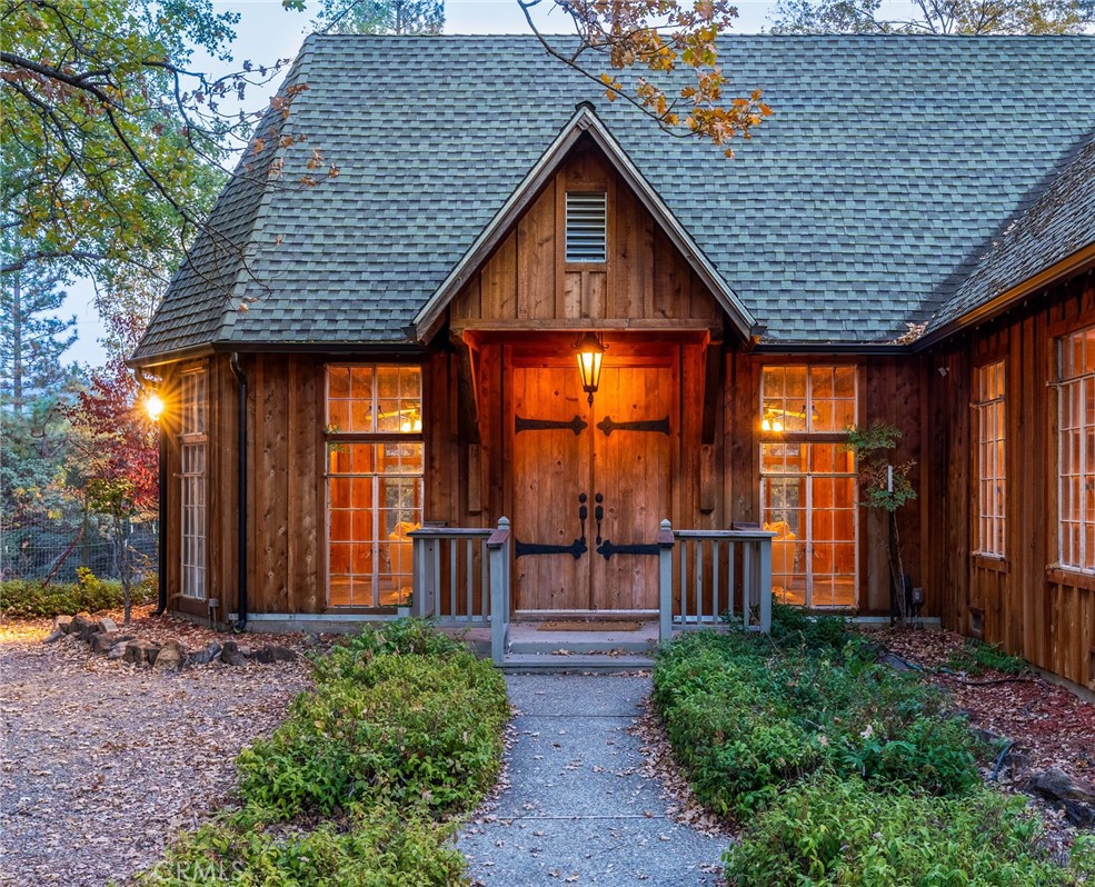 a front view of a house with garden