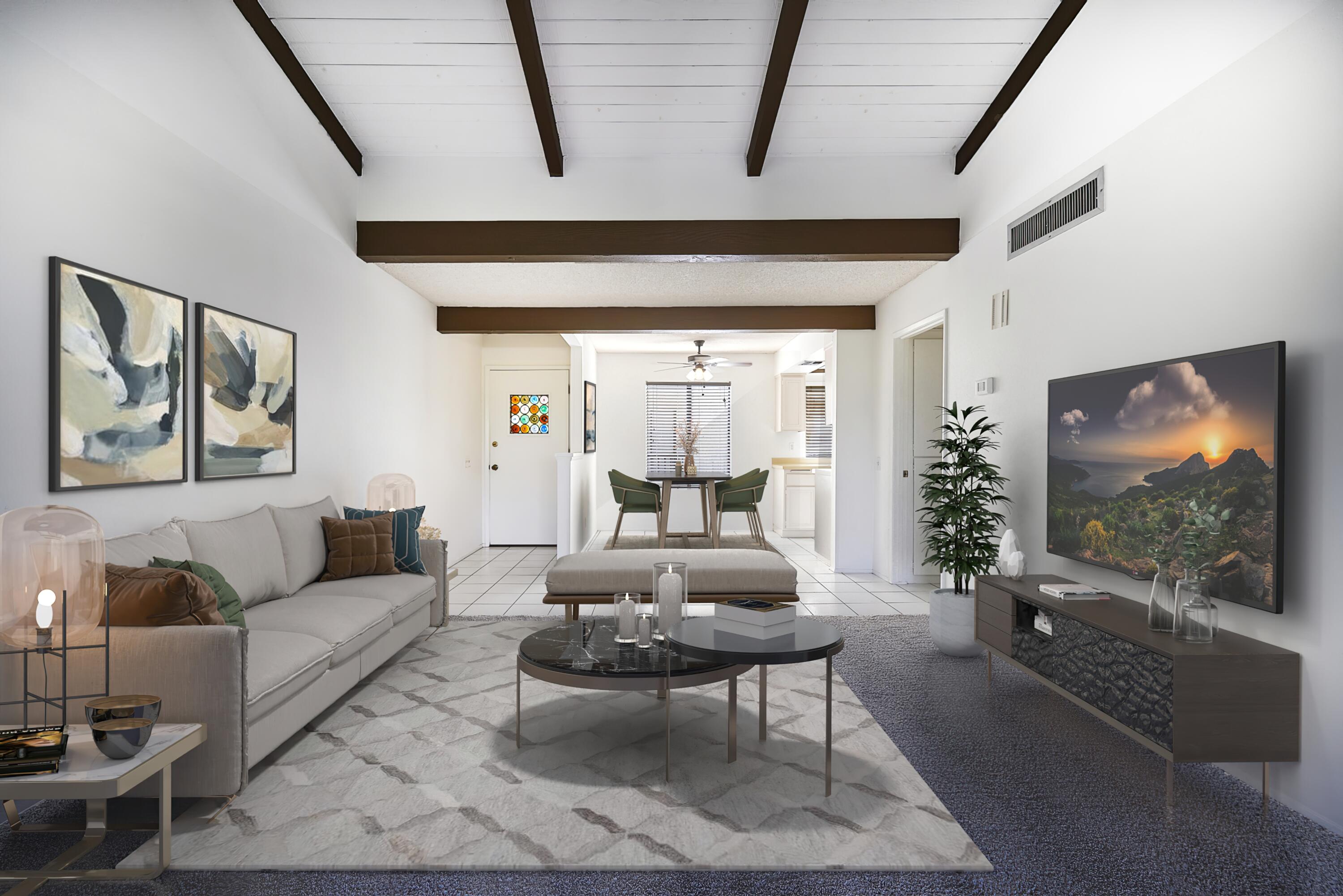 a living room with furniture and a flat screen tv