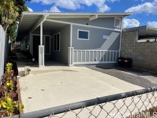 front view of a house with a fence