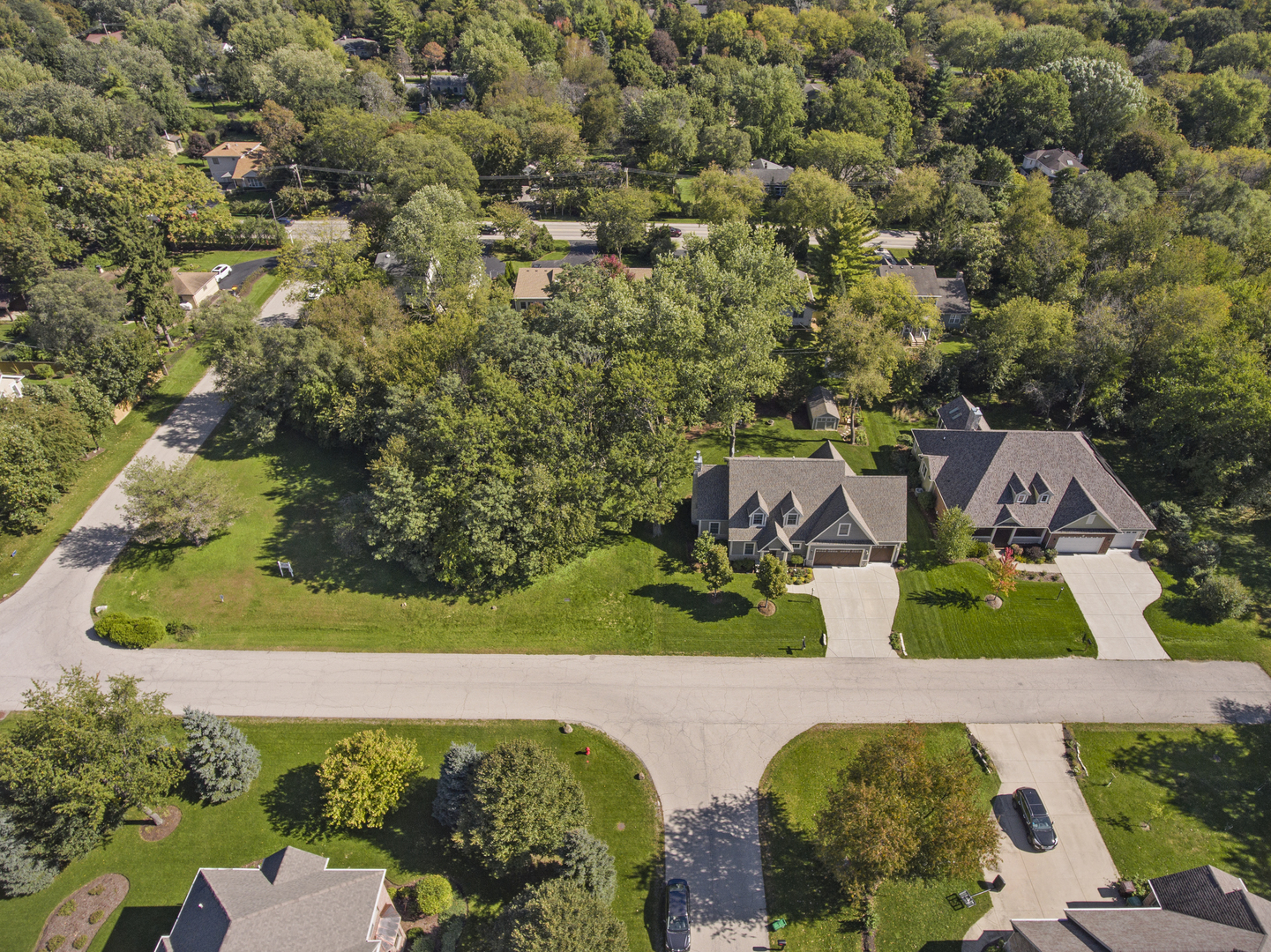 an aerial view of a house with yard