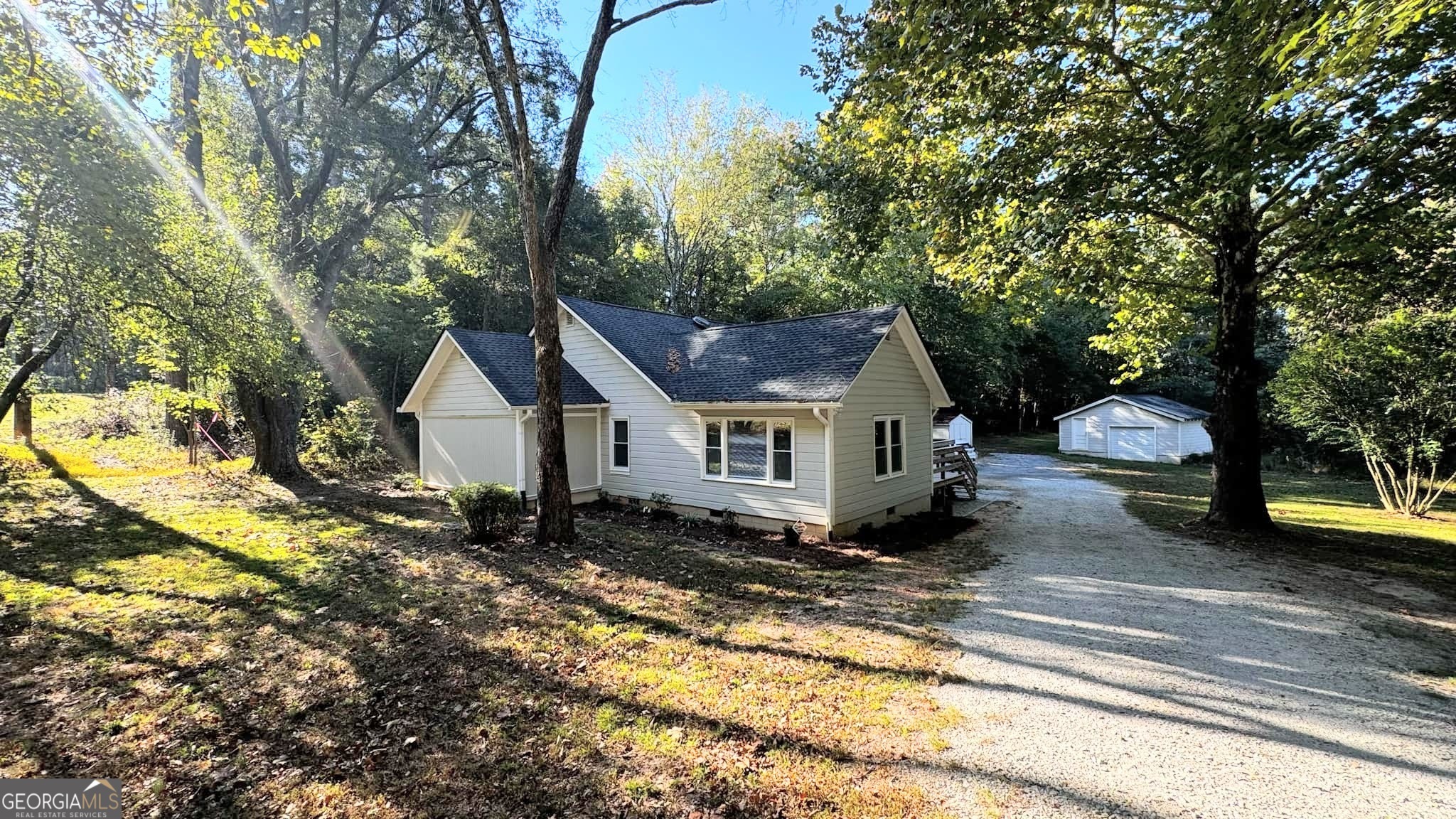 a house with trees in the background