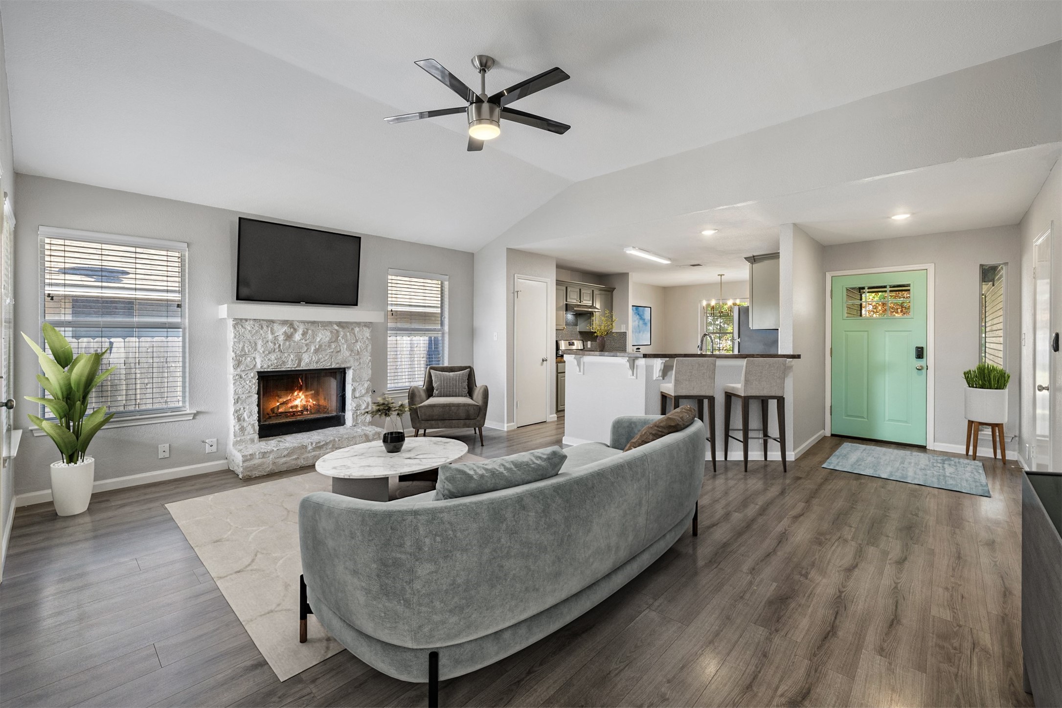 a living room with furniture and a fireplace