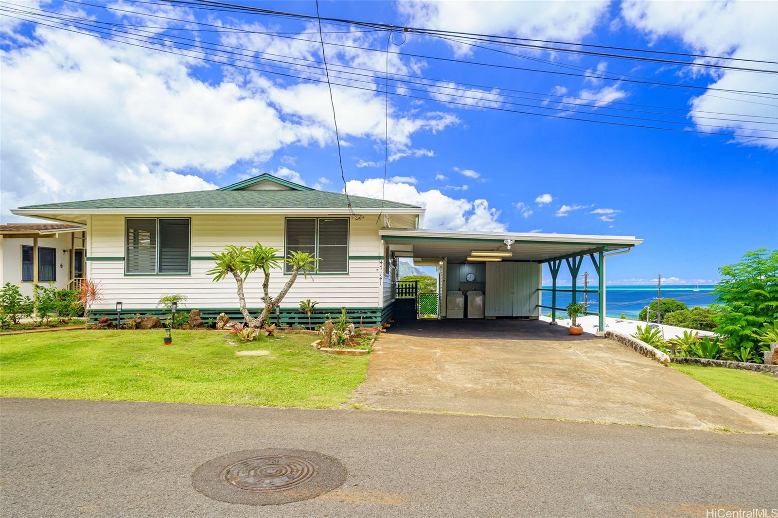 a front view of a house with swimming pool yard and outdoor seating