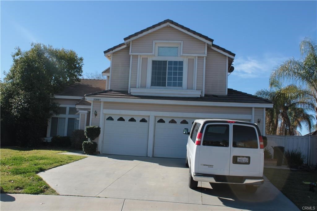 a front view of a house with garage