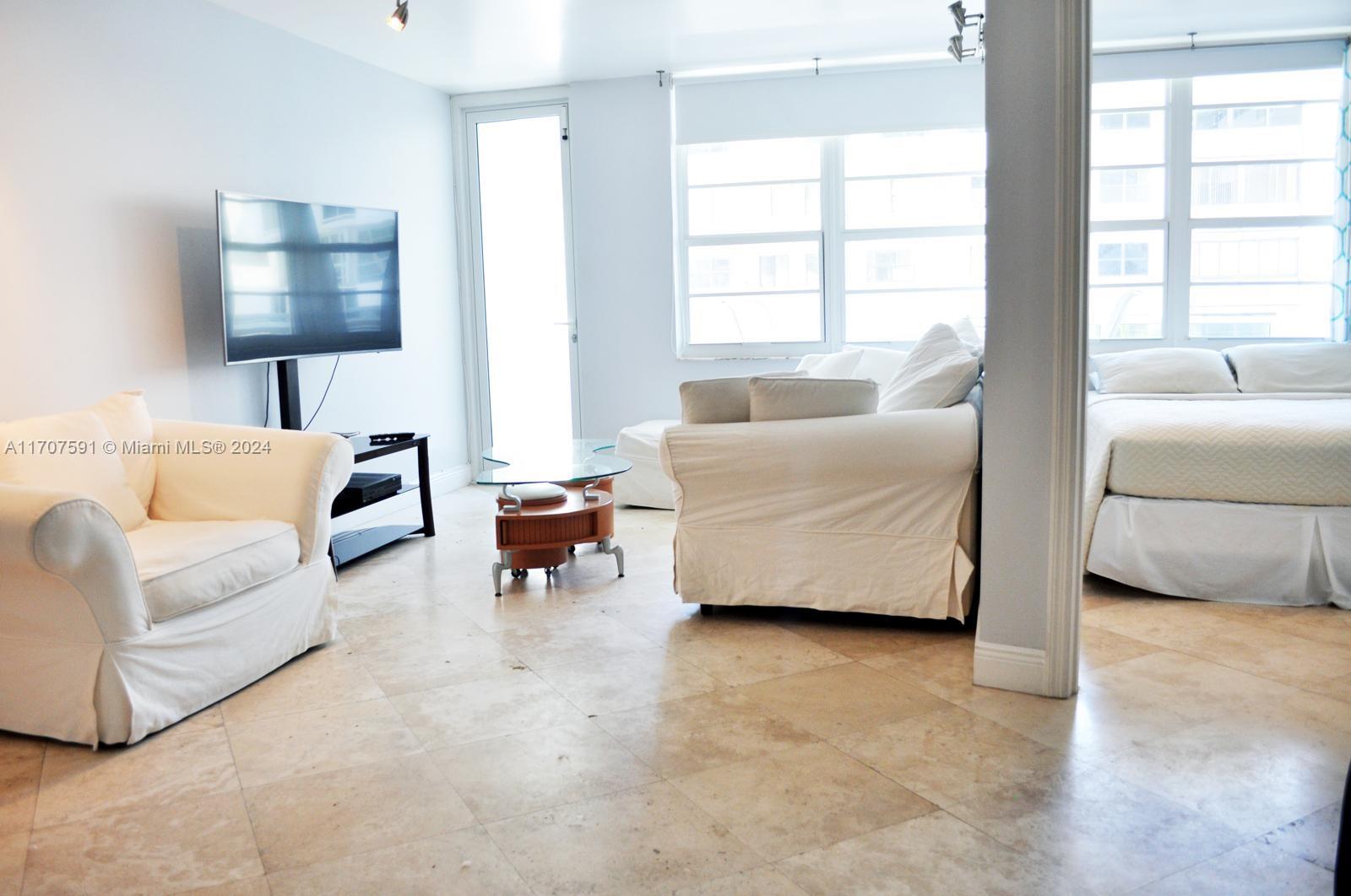 a living room with furniture and a window