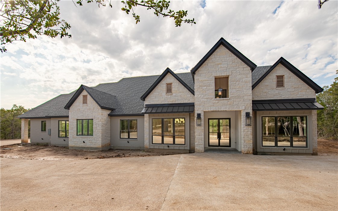 front view of a house with a yard