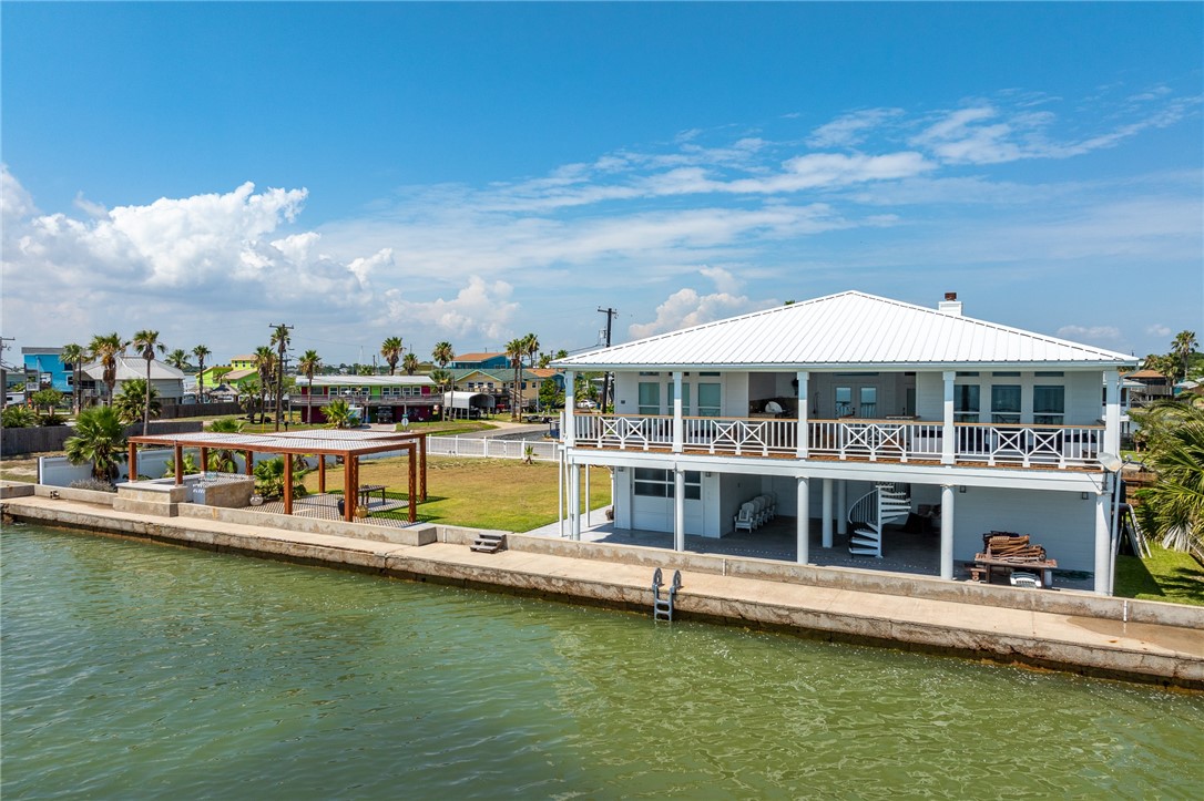 a view of a lake with a house swimming pool and outdoor space