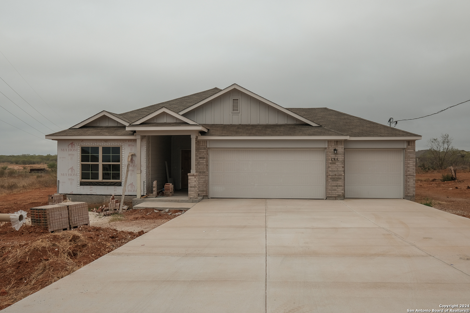 a front view of a house with yard