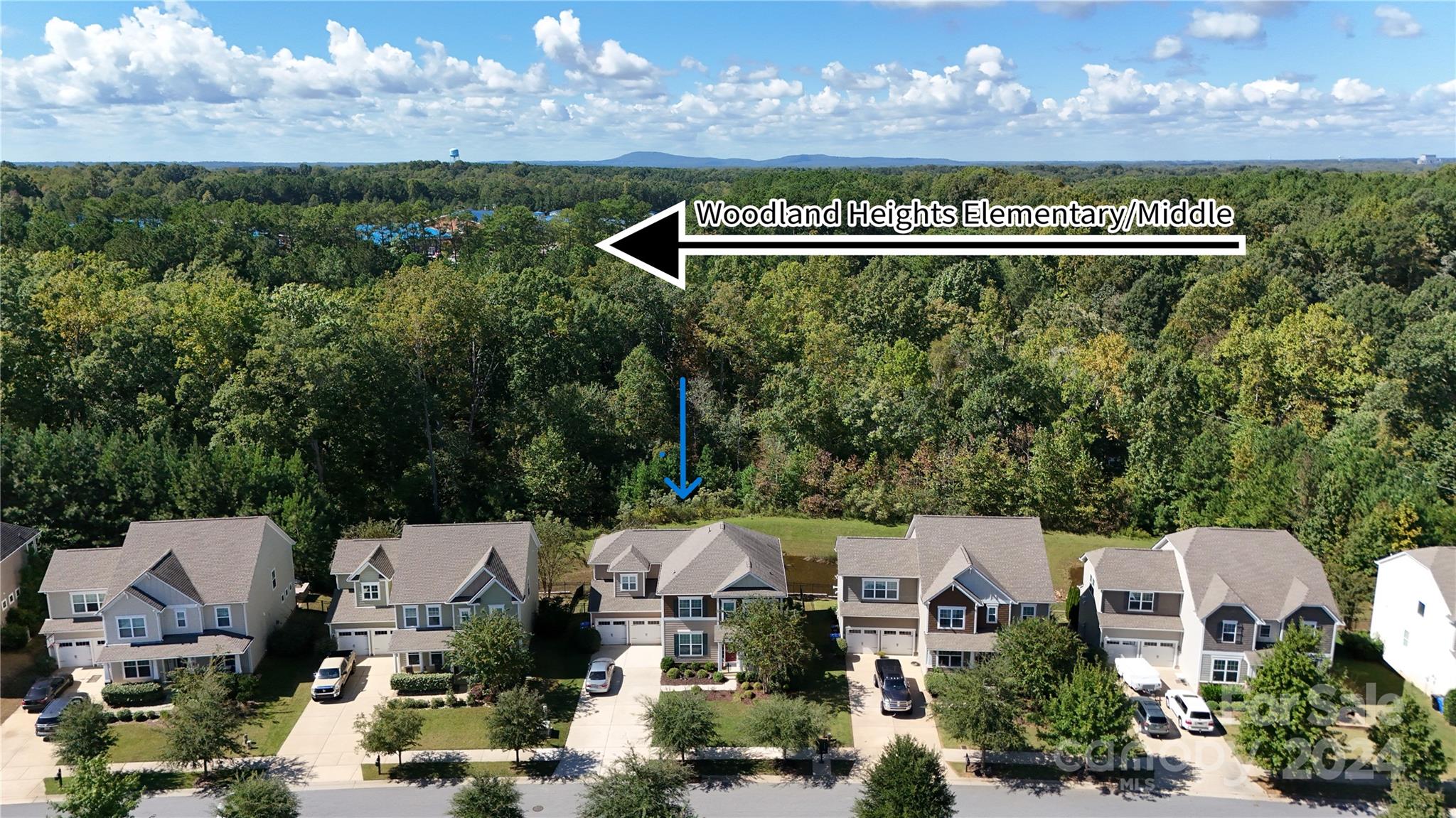 an aerial view of a house with a garden