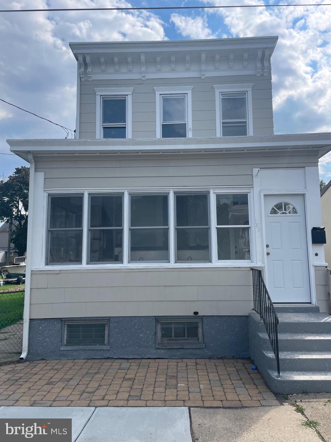 a front view of a house with a large window