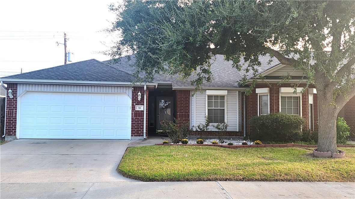 a front view of house with garage