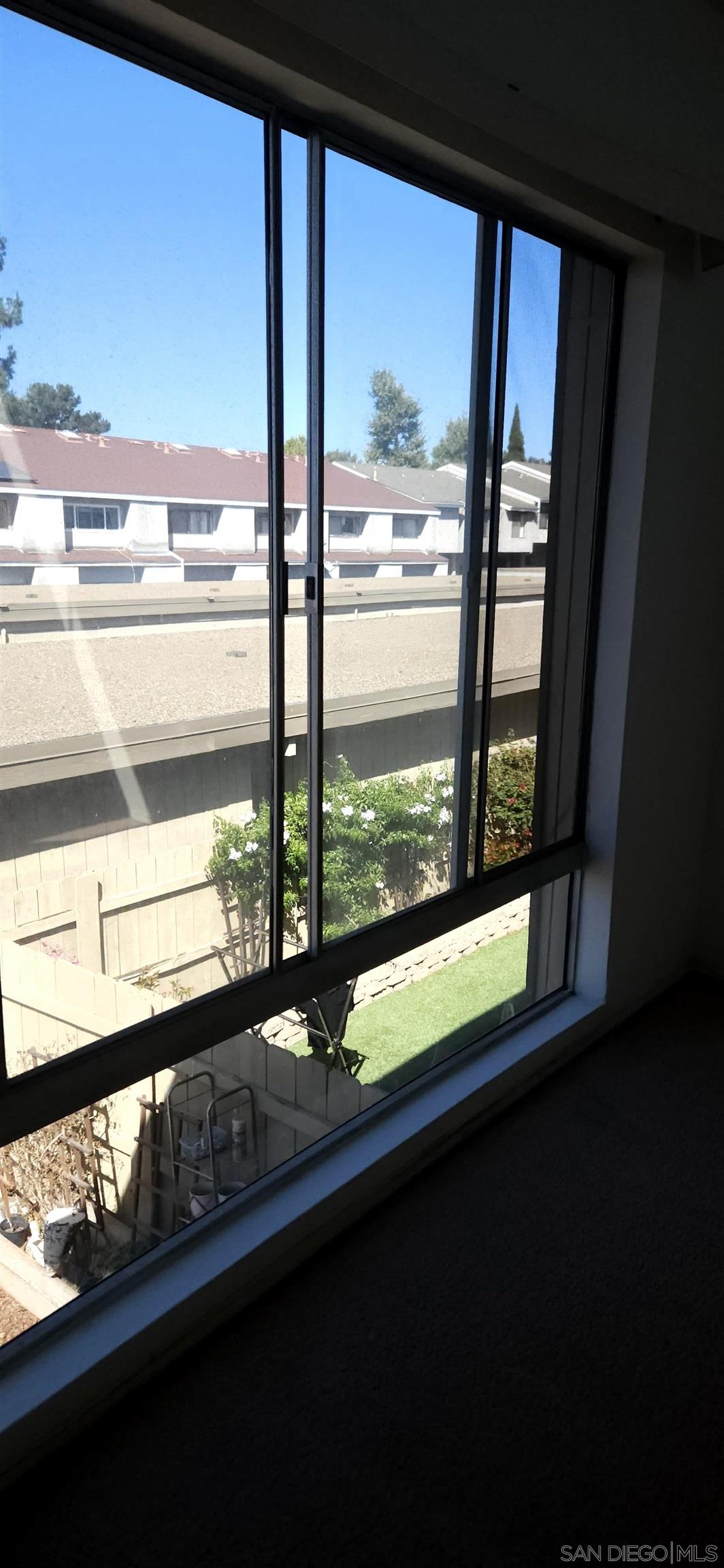 a view of a glass door with a view from a window