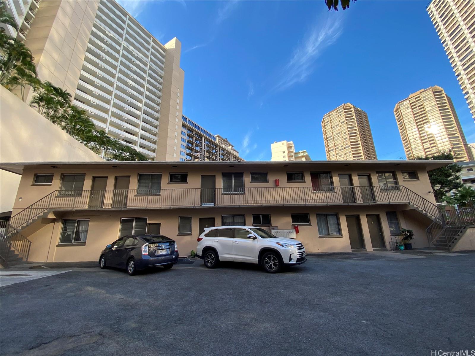 a view of a car parked in front of a building