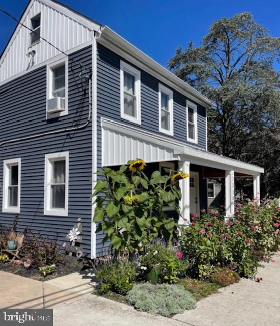 a front view of a house with plants