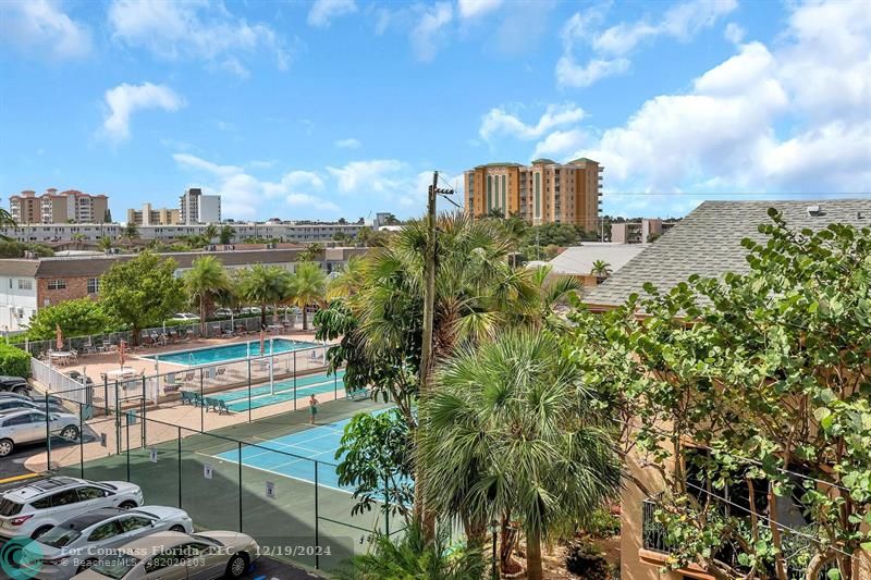 BALCONY VIEW TO CITY LIGHT, POOL & TENNIS COURT