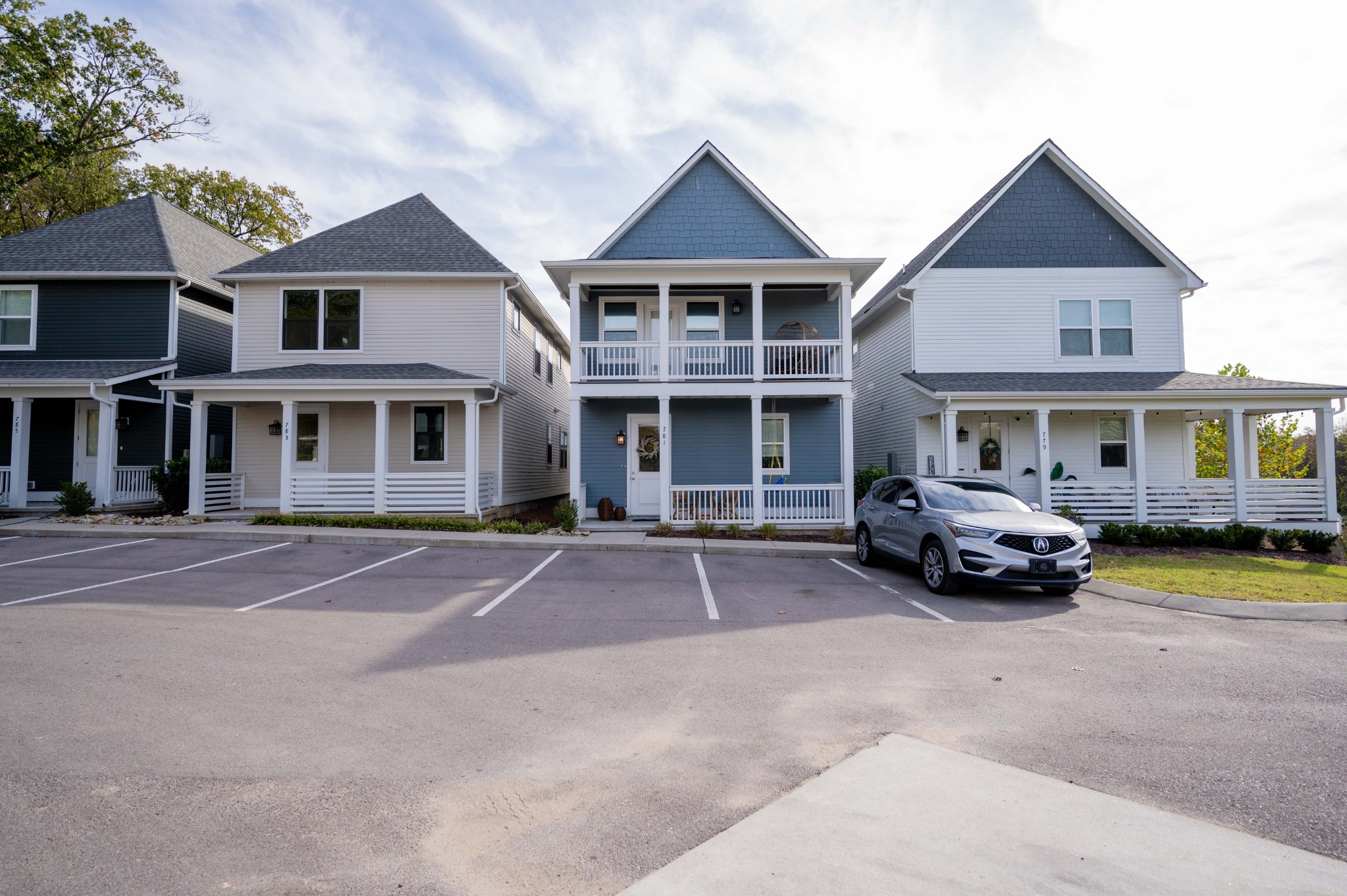 a front view of a residential apartment building with a yard