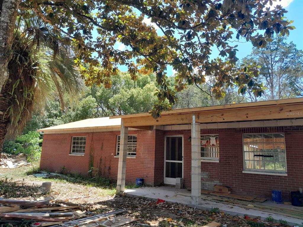 a view of a house with a tree