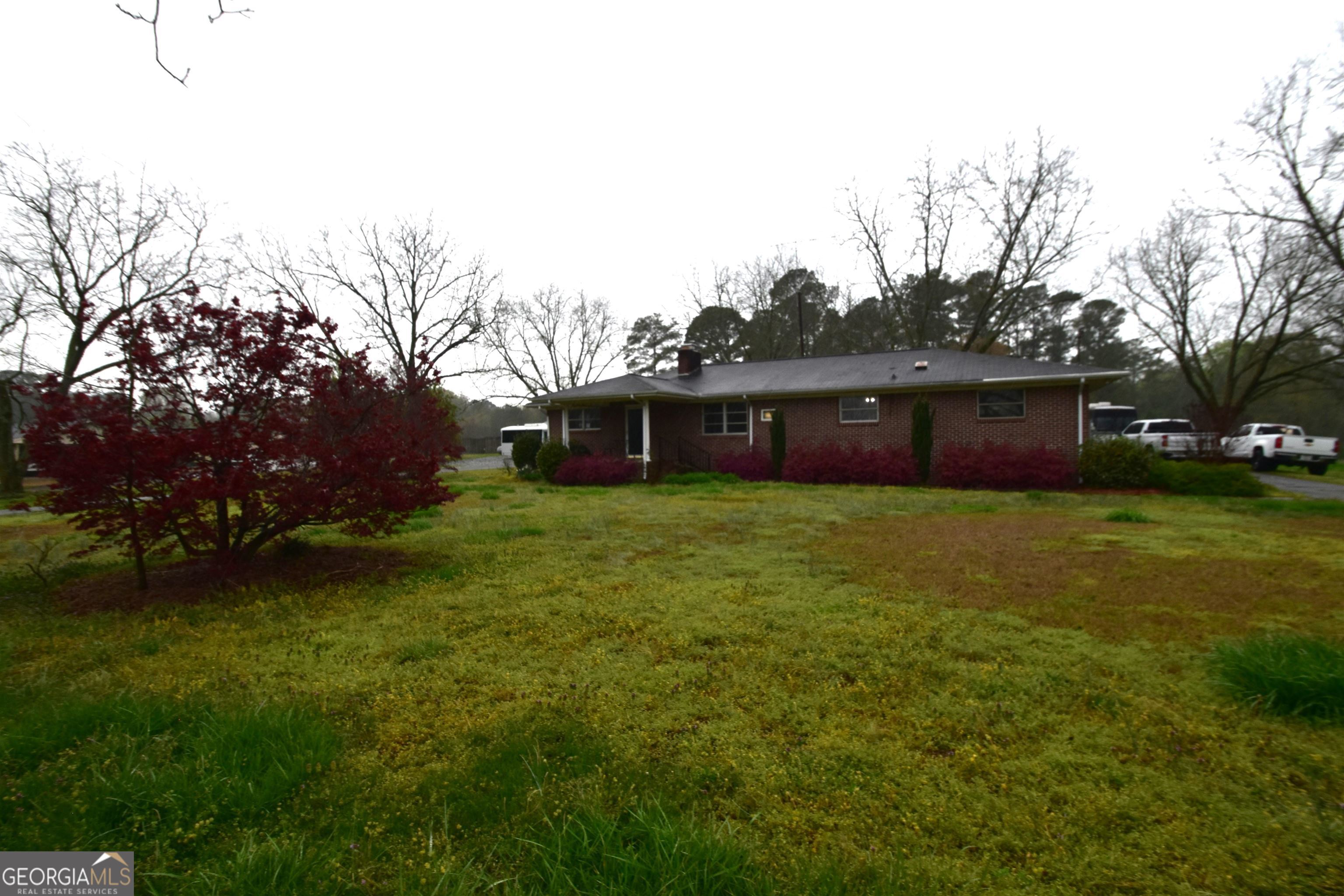 a front view of house with garden