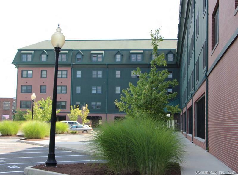 a front view of a building with garden