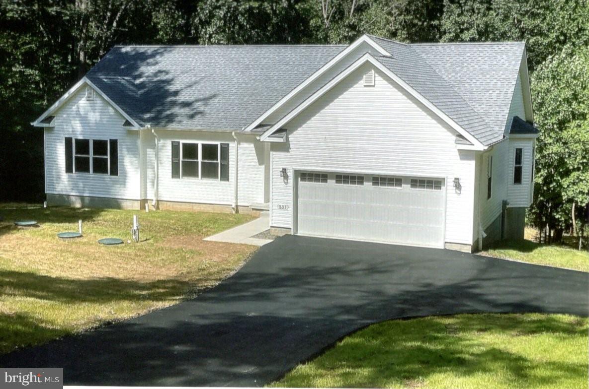 a view of a house with pool and yard