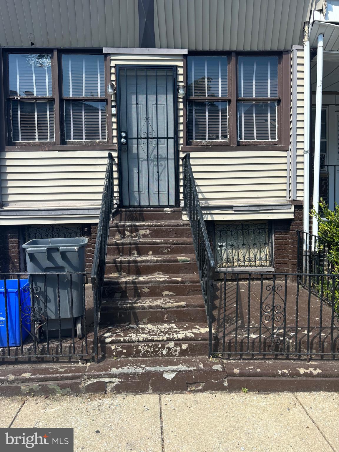 a front view of a house with stairs