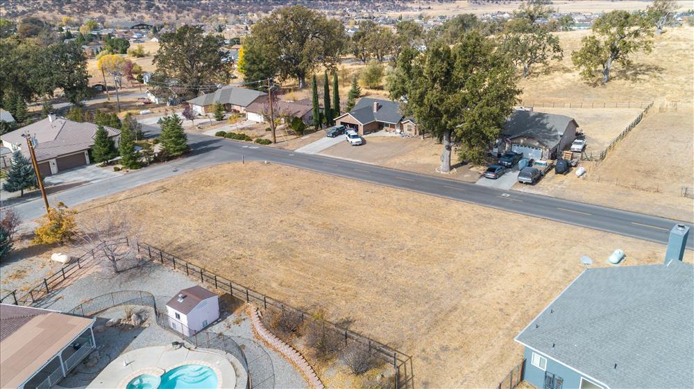 an aerial view of a house with outdoor space