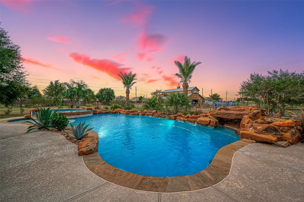 a view of a swimming pool with a yard