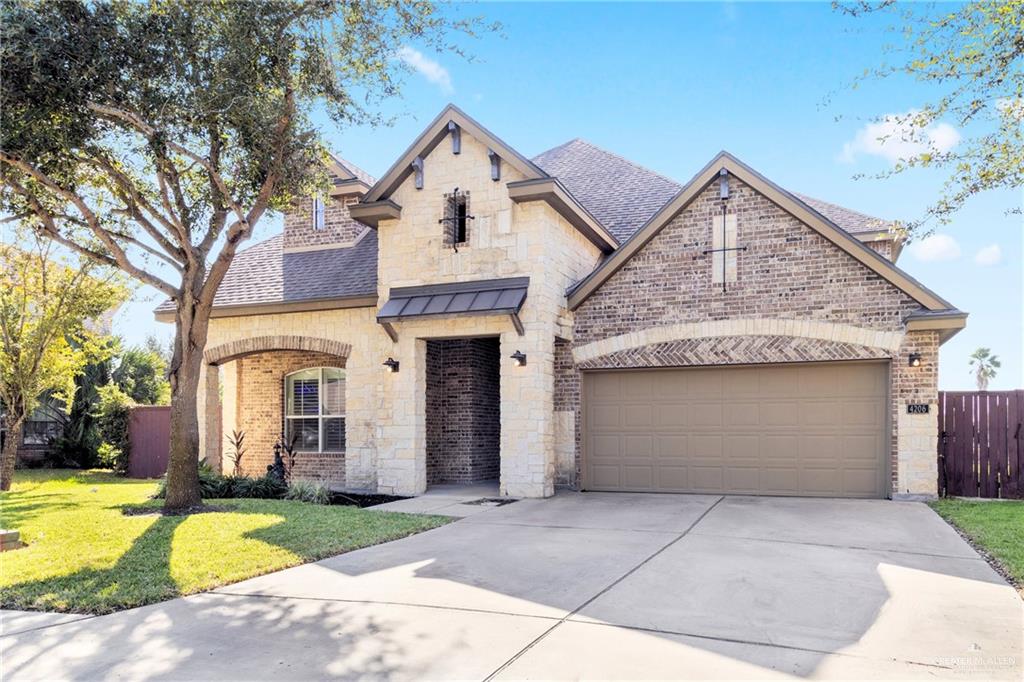 View of front of property with a front yard