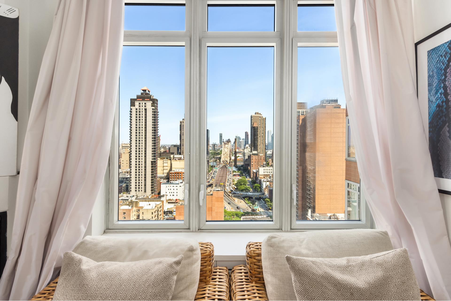 a living room with a large window and a couch