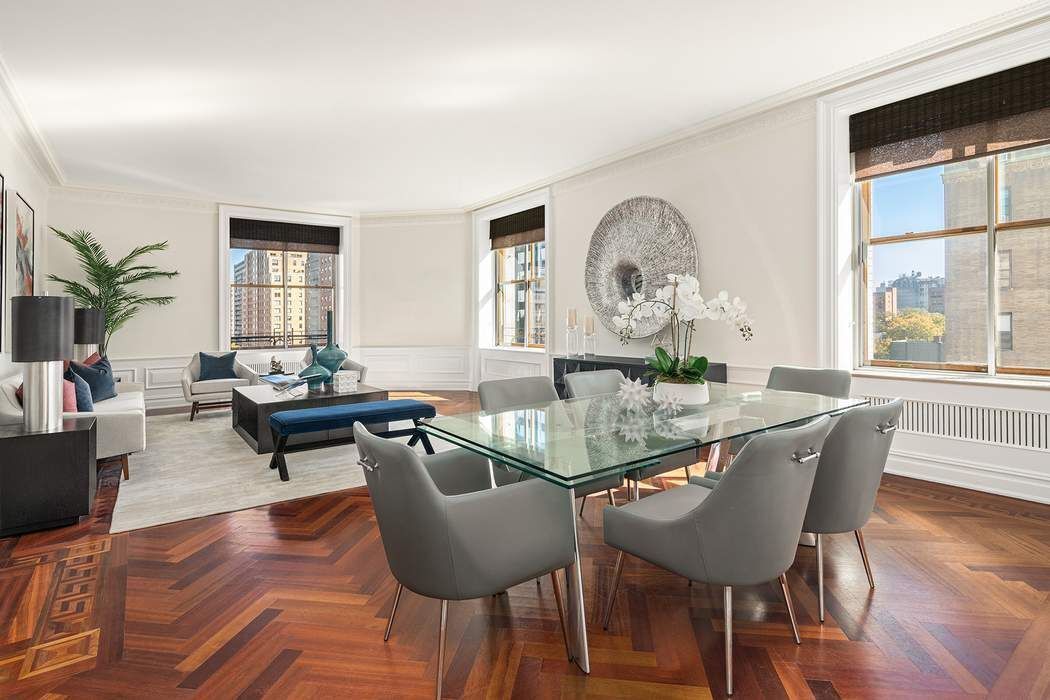 a view of a dining room with furniture window and wooden floor