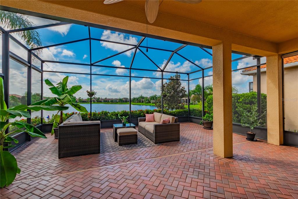 a view of a patio with couches and potted plants