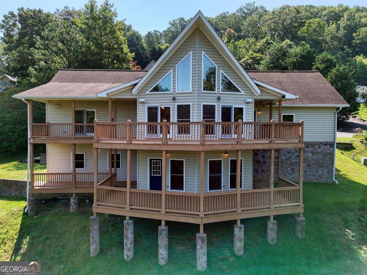 a view of a house with a yard from a balcony