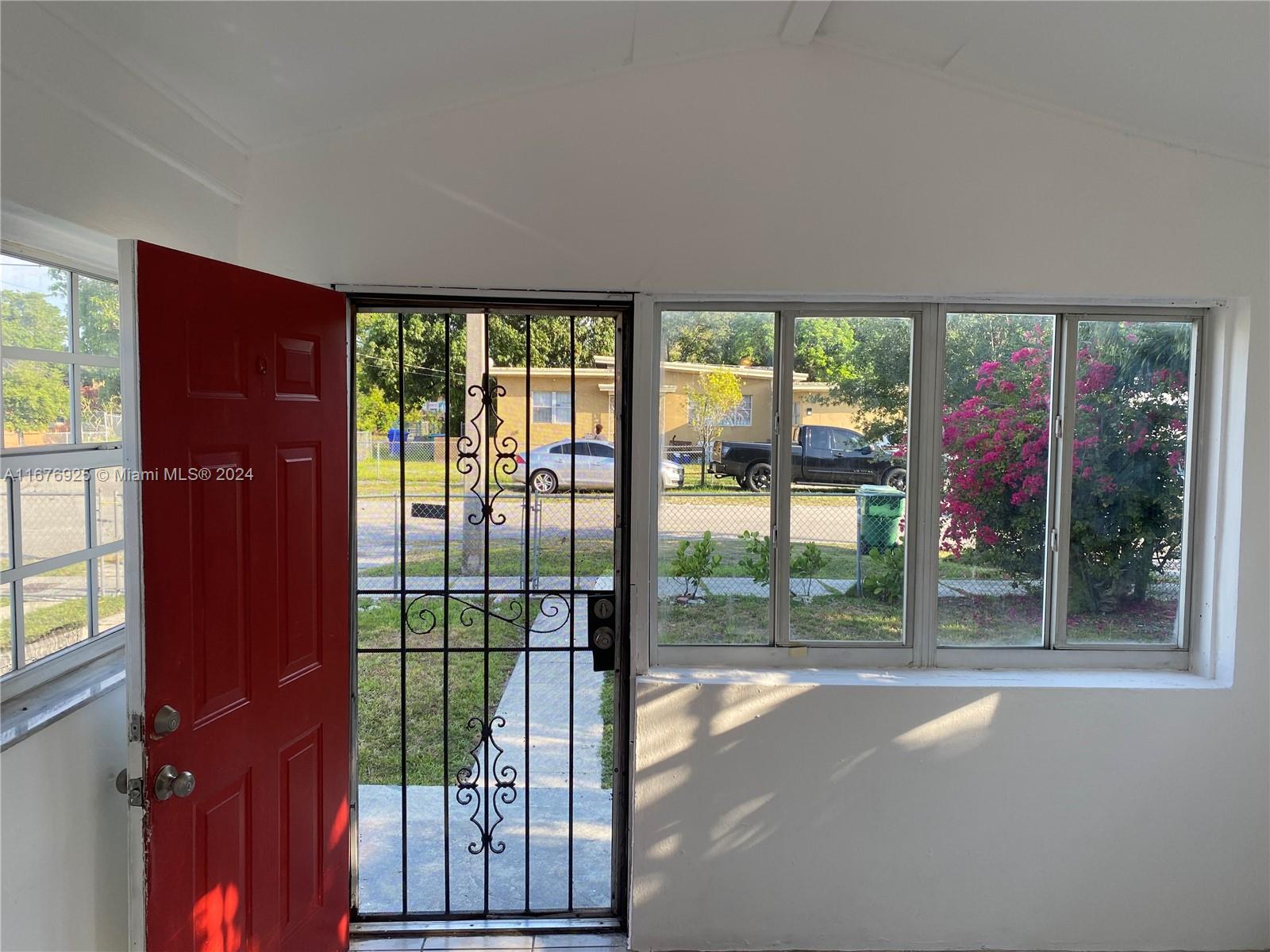 a view of a room that has a large window