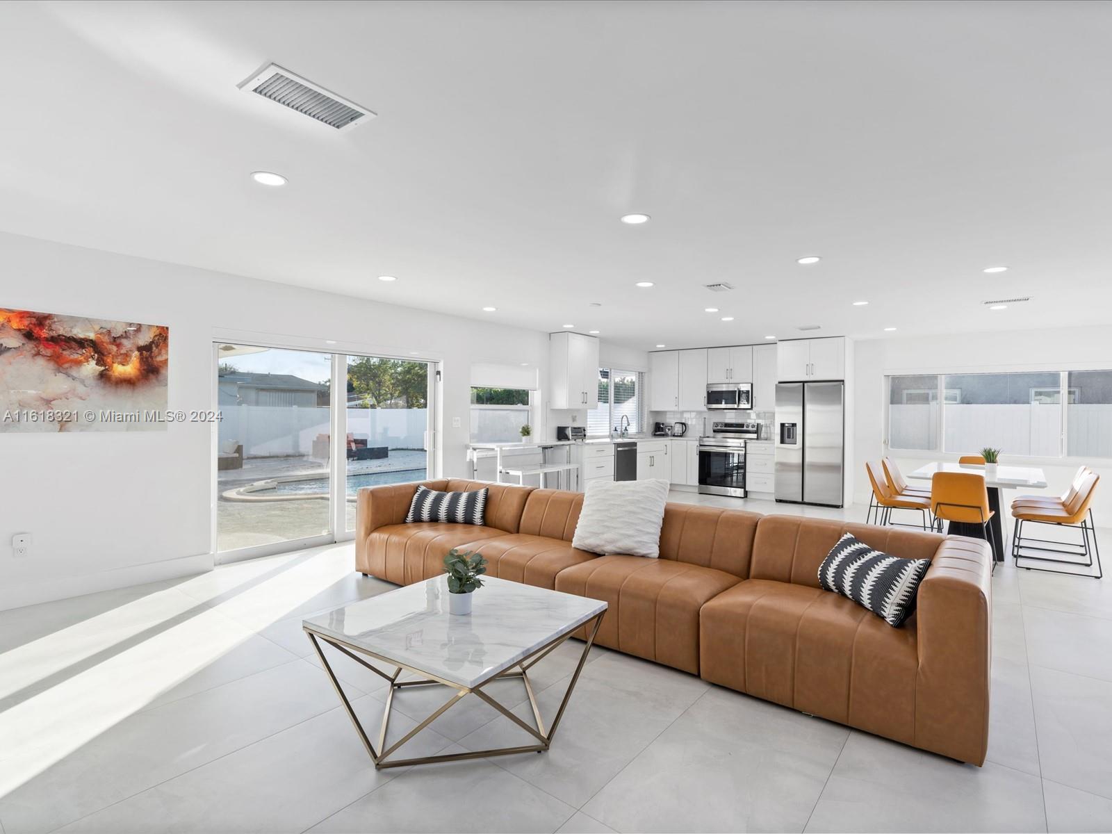 a living room with furniture and a table