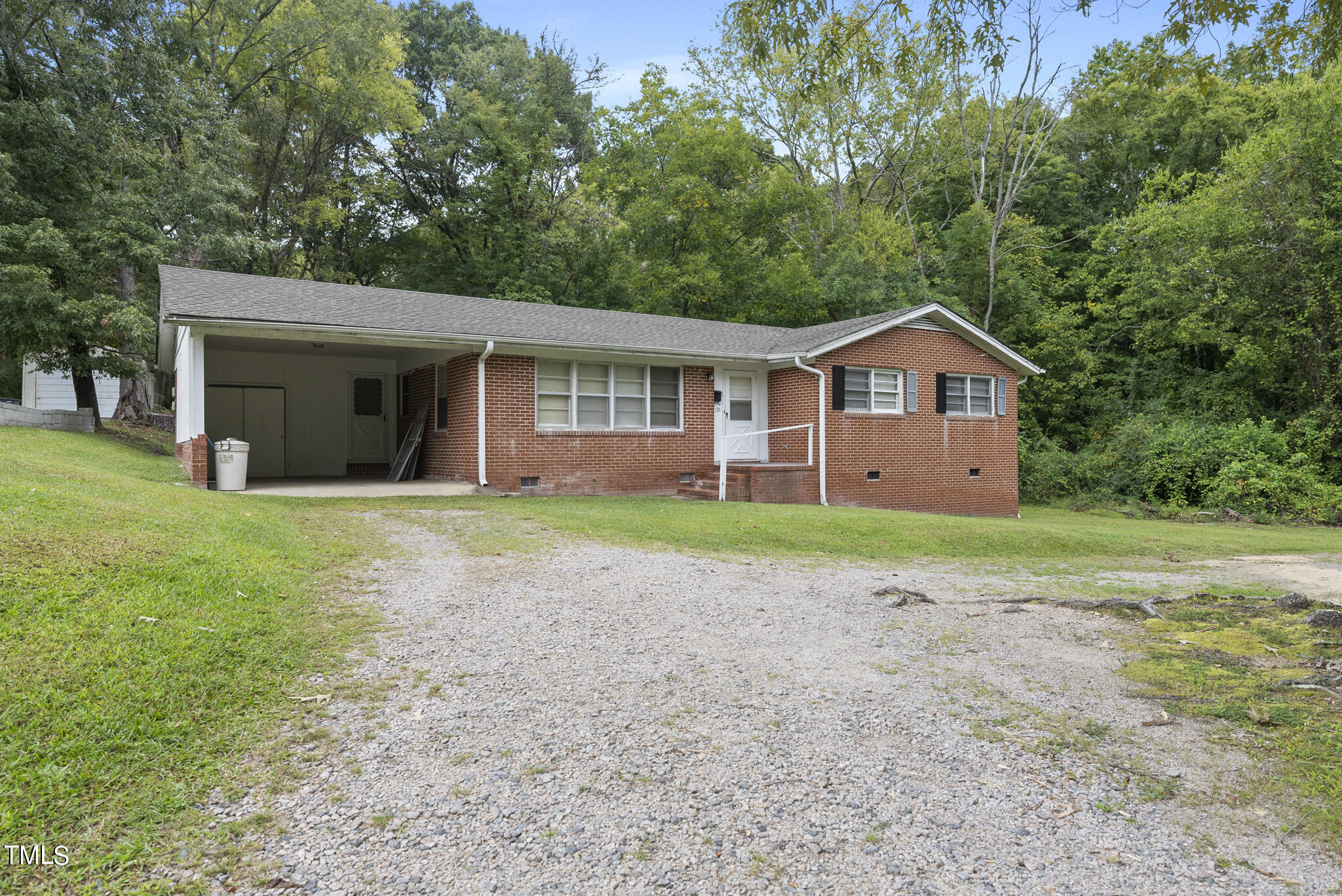 a view of a house with yard and tree s