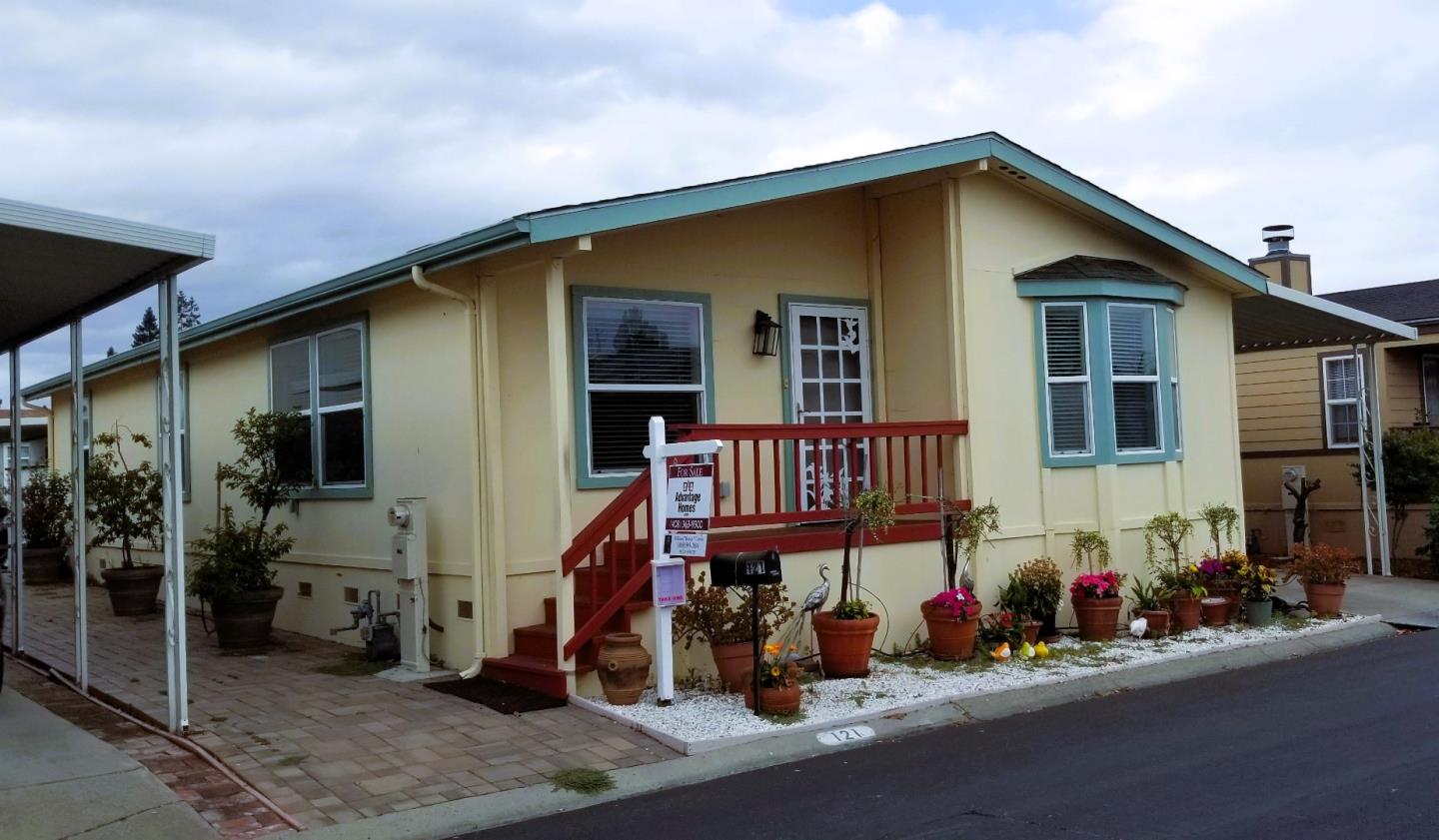 a view of a house with wooden deck