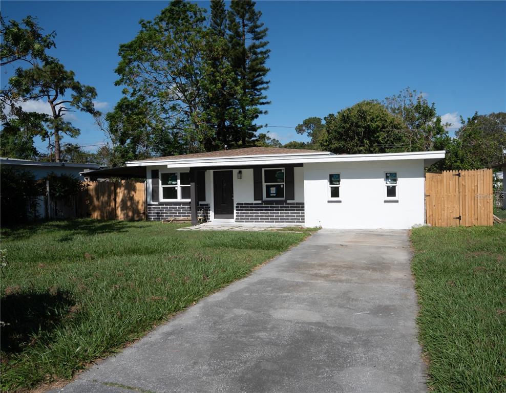 front view of a house with a yard