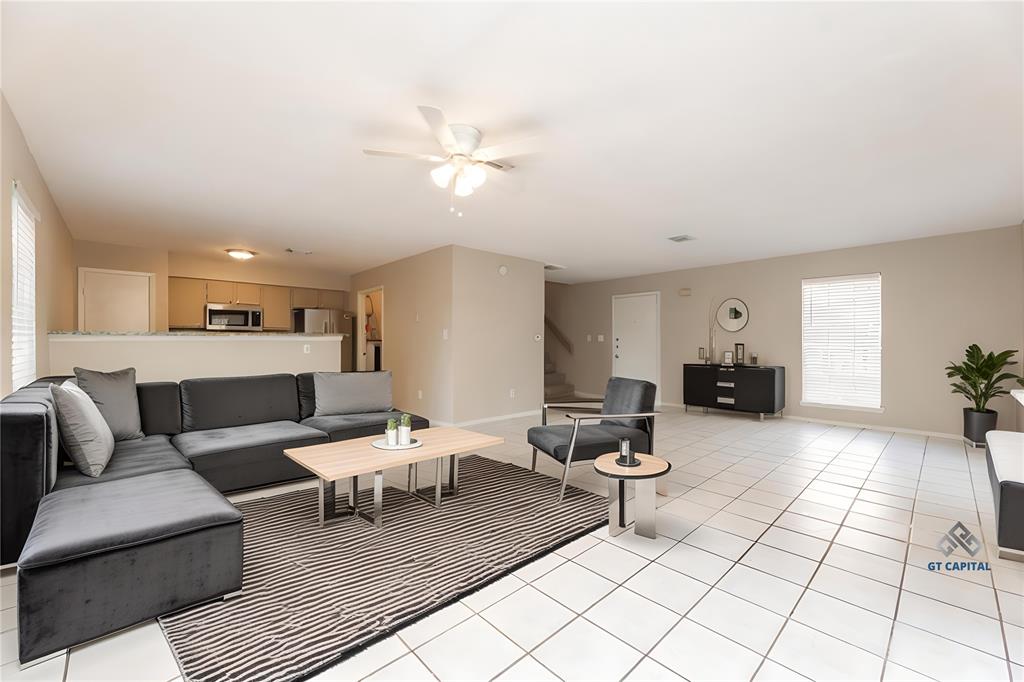 a living room with furniture and a rug