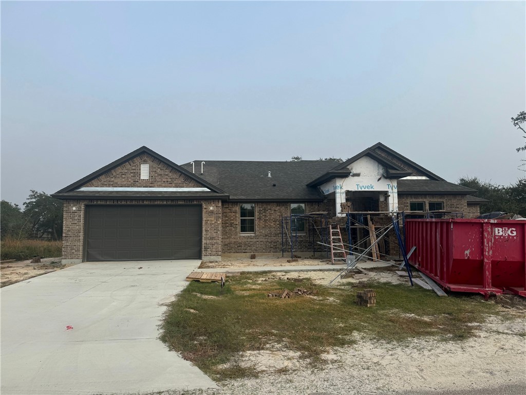 a front view of a house with garage