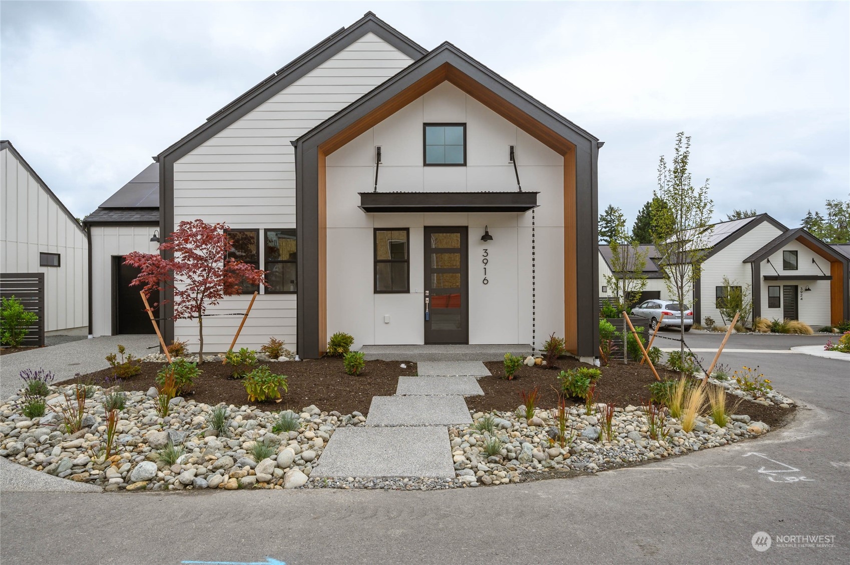 a front view of a house with garden