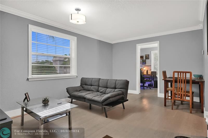 a living room with furniture and a window